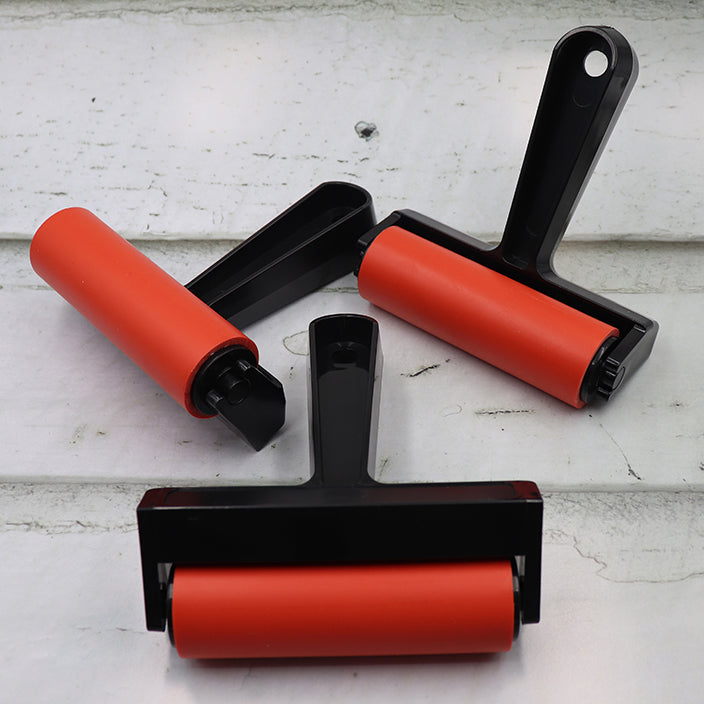 Lightweight handy plastic handled rubber roller.